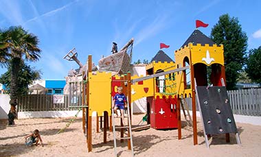 Play structure and slide for children at Le Bois Tordu 85 campsite