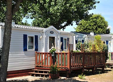 Terrace of a mobile home for rent at the campsite in Vendée Le Bois Tordu
