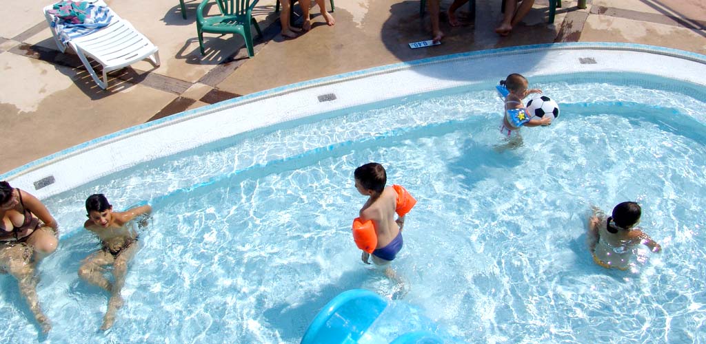 Children playing in the paddling pool of the aquatic area of the campsite in Saint-Hilaire-de-Riez